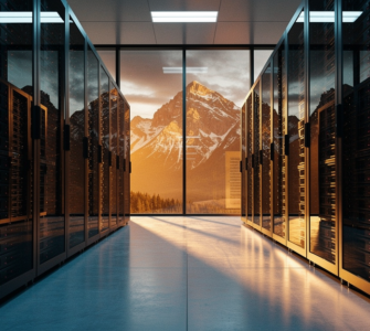 Modern data center with rows of black server racks framing a panoramic view of the Canadian Rocky Mountains at golden hour
