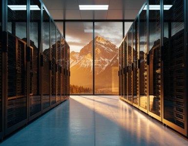 Modern data center with rows of black server racks framing a panoramic view of the Canadian Rocky Mountains at golden hour