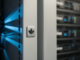 Close-up of server rack panels with a Canadian maple leaf etched in metal, blue LED lighting