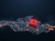 A glowing data-network rendering of Canada on a dark blue field with a red maple leaf focal point