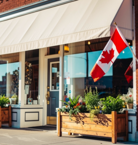 Canadian small business storefront on a main street with a Canadian flag