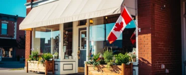 Canadian small business storefront on a main street with a Canadian flag