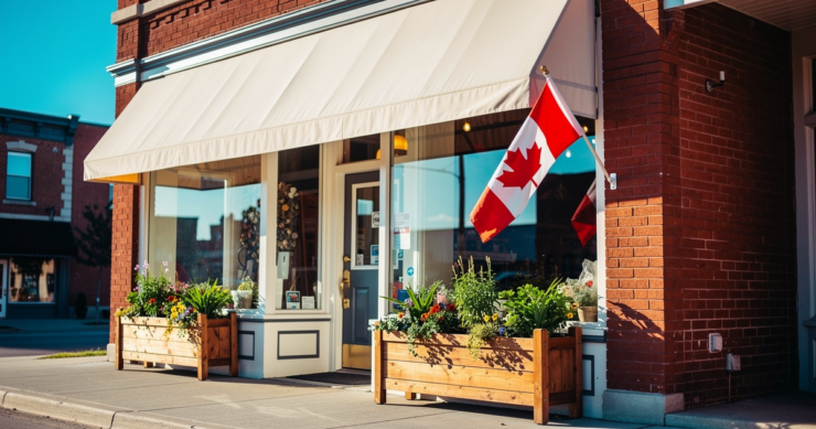 Canadian small business storefront on a main street with a Canadian flag