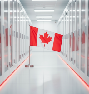 A small Canadian flag standing in a bright modern data centre aisle with red LED accents