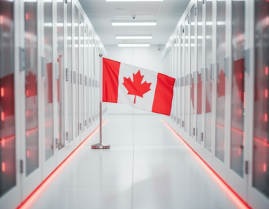 A small Canadian flag standing in a bright modern data centre aisle with red LED accents